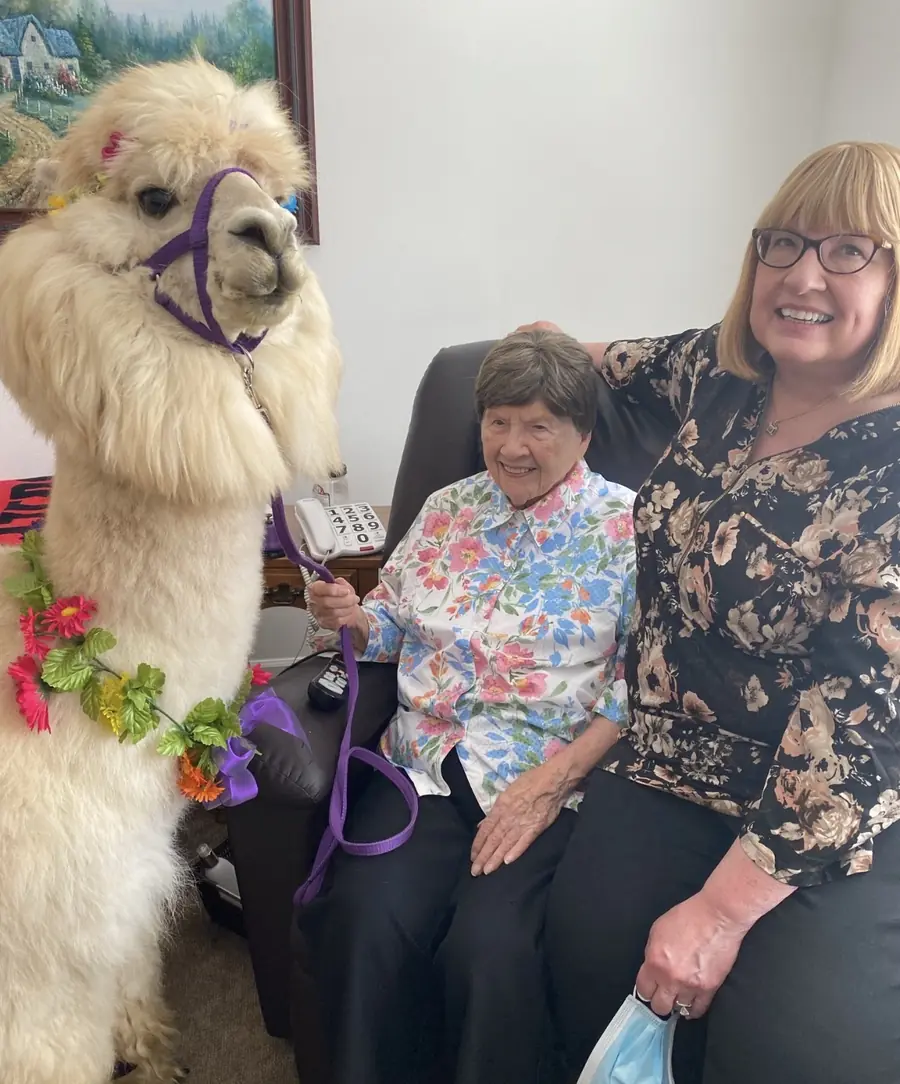 Resident and family member sharing a warm moment at Neighbor Care Homes